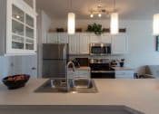 Thumbnail 4 of 147 - This is a photo of the kitchen in the 1242 square foot, 2 bedroom, 2 and 1/2 bath Spinnaker floor plan at Nantucket Apartments in Loveland, OH.