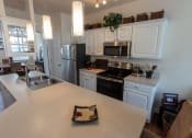 Thumbnail 3 of 147 - This is a photo of the kitchen in the 1242 square foot, 2 bedroom, 2 and 1/2 bath Spinnaker floor plan at Nantucket Apartments in Loveland, OH.