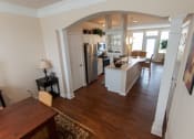 Thumbnail 50 of 147 - This is a photo of the dining room and kitchen from the stairwell in the 1242 square foot, 2 bedroom, 2 and 1/2 bath Spinnaker floor plan at Nantucket Apartments in Loveland, OH.