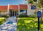Thumbnail 53 of 62 - A sign for Princeton Court Information Center is displayed in front of the leasing office at Princeton Court Apartments in the Vickery Midtown neighborhood of Dallas, TX.