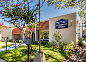 Thumbnail 56 of 62 - A sign for Princeton Court Information Center is displayed in front of the leasing office at Princeton Court Apartments in the Vickery Midtown neighborhood of Dallas, TX.