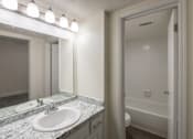 Thumbnail 30 of 62 - A bathroom with white vanity 1 bedroom, 1 bath apartment home at Princeton Court Apartments in the Vickery Midtown neighborhood of Dallas, TX.