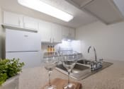 Thumbnail 9 of 50 - kitchen and hallway at Princeton Court, Dallas