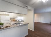 Thumbnail 31 of 50 - kitchen and hallway  at Princeton Court, Dallas, Texas