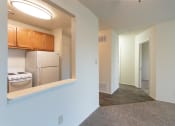 Thumbnail 14 of 78 - This is a photo of a large kitchen pass through and the hallway in a 560 square foot 1, 1 bath apartment at Park Lane Apartments in Cincinnati, OH.
