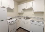 Thumbnail 9 of 78 - This is a photo of a kitchen with white cabinets and white appliances in a 560 square foot 1, 1 bath apartment at Park Lane Apartments in Cincinnati, OH.