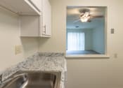 Thumbnail 10 of 78 - This is a photo of a kitchen with white cabinets and white appliances in a 560 square foot 1, 1 bath apartment at Park Lane Apartments in Cincinnati, OH.
