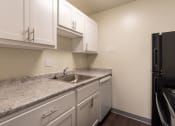 Thumbnail 5 of 78 - This is a photo of the kitchen in a 849 square foot split 2 bedroom, 2 bath apartment at Park Lane Apartments in Cincinnati, OH.