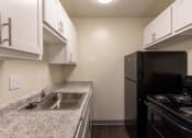 Thumbnail 6 of 78 - This is a photo of the kitchen in a 849 square foot split 2 bedroom, 2 bath apartment at Park Lane Apartments in Cincinnati, OH.