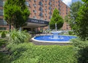 Thumbnail 74 of 78 - This is a photo of the building exterior featuring the fountain in front of the entrance to Park Lane Apartments in Cincinnati, OH.