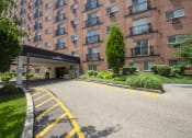 Thumbnail 77 of 78 - This is a photo of the building exterior showing the entrance to Park Lane Apartments in Cincinnati, OH.