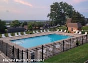 Thumbnail 65 of 74 - A pool surrounded by a black fence at Fairfield Pointe Apartments.