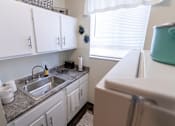 Thumbnail 1 of 29 - This is a picture of the kitchen in a 576 sq foot 1 bedroom, 1 bath apartment at Red Bank Reserve in the Madisonville neighborhood of Cincinnati, Ohio.