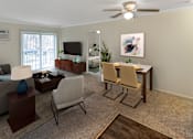 Thumbnail 8 of 38 - This is a photo of the digitally staged living room of a 742 square foot, 2 bedroom apartment at Romaine Court Apartments in the Oakley neighborhood of Cincinnati, Ohio.