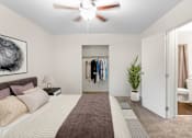 Thumbnail 16 of 38 - This is a photo of the digitally staged primary bedroom of a 742 square foot, 2 bedroom apartment at Romaine Court Apartments in the Oakley neighborhood of Cincinnati, Ohio.