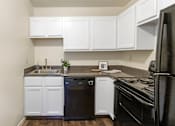 Thumbnail 5 of 38 - This is a photo of the kitchen of a 742 square foot, 2 bedroom apartment at Romaine Court Apartments in the Oakley neighborhood of Cincinnati, Ohio.