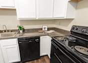 Thumbnail 6 of 38 - This is a photo of the kitchen of a 742 square foot, 2 bedroom apartment at Romaine Court Apartments in the Oakley neighborhood of Cincinnati, Ohio.