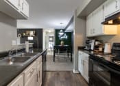 Thumbnail 3 of 98 - This is a photo of the dining room from the  kitchen in the 1226 square foot 3 bedroom, 2 bath Hambletonian at Trails of Saddlebrook Apartments in Florence, KY.