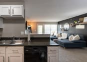 Thumbnail 4 of 98 - This is a photo of the living room from the kitchen in the 1226 square foot 3 bedroom, 2 bath Hambletonian at Trails of Saddlebrook Apartments in Florence, KY.