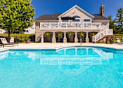 Thumbnail 20 of 96 - A house with a pool in front.