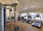 Thumbnail 32 of 44 - The 24-hour fitness center with treadmill, elliptical, free weights and other workout machines at The Summit at Midtown Apartments in Midtown, Dallas, TX.