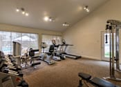 Thumbnail 34 of 44 - The 24-hour fitness center with treadmill, elliptical, free weights and other workout machines at The Summit at Midtown Apartments in Midtown, Dallas, TX.