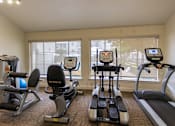 Thumbnail 35 of 44 - The 24-hour fitness center with treadmill, elliptical, free weights and other workout machines at The Summit at Midtown Apartments in Midtown, Dallas, TX.