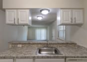 Thumbnail 20 of 34 - This is a photo of the kitchen in the 963 square foot 2 bedroom, 2 bath apartment at The Summit at Midtown Apartments in Dallas, TX.