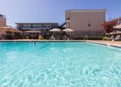 Thumbnail 26 of 34 - This is a photo of the pool area at The Summit at Midtown Apartments in Dallas, TX.