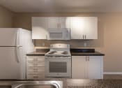Thumbnail 14 of 75 - This is a photo of the kitchen in the 1040 square foot 2 bedroom, 1 bath Patriot at Washington Place Apartments in Miamisburg, Ohio in Washington Township.