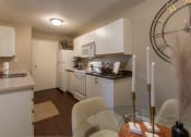 Thumbnail 25 of 75 - This is a photo of the kitchen and dining room of the 890 square foot 2 bedroom, 2 bath Liberty at Washington Place Apartments in in Miamisburg, Ohio in Washington Township.