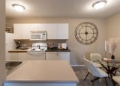 Thumbnail 26 of 75 - This is a photo of the kitchen and dining room of the 890 square foot 2 bedroom, 2 bath Liberty at Washington Place Apartments in in Miamisburg, Ohio in Washington Township.