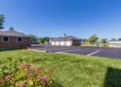 Thumbnail 69 of 75 - This is a photo of a pond with a fountain and detached garages at Washington Place Apartments in Miamisburg, Ohio in Washington Township.