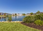 Thumbnail 67 of 75 - This is a photo of a pond with a fountain and building exteriors at Washington Place Apartments in Miamisburg, Ohio in Washington Township.