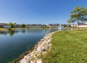 Thumbnail 66 of 75 - This is a photo of a pond with a fountain and building exteriors at Washington Place Apartments in Miamisburg, Ohio in Washington Township.
