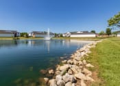Thumbnail 70 of 75 - This is a photo of a pond with a fountain and building exteriors at Washington Place Apartments in Miamisburg, Ohio in Washington Township.