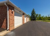 Thumbnail 71 of 75 - This is a photo of a pond with a fountain and detached garages at Washington Place Apartments in Miamisburg, Ohio in Washington Township.