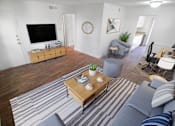Thumbnail 2 of 31 - This is a photo of a virtually staged living room in the 751 square foot 1 bedroom, 1 bath apartment at Woodbridge Apartments in Dallas, TX.