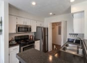 Thumbnail 1 of 57 - This is a photo of the kitchen of the 1100 square foot 2 bedroom Kettering floor plan at Washington Park Apartments in Centerville, OH.