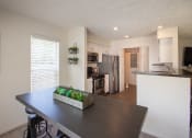 Thumbnail 22 of 57 - This is a photo of the kitchen from the diding room of the 1100 square foot 2 bedroom Kettering floor plan at Washington Park Apartments in Centerville, OH.
