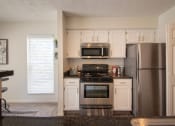 Thumbnail 2 of 57 - This is a photo of the kitchen of the 1100 square foot 2 bedroom Kettering floor plan at Washington Park Apartments in Centerville, OH.