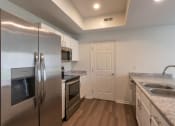 Thumbnail 5 of 57 - This is a photo of the kitchen of the 1500 square foot 3 bedroom, 2 and a half bath with 2-car garage Bellbrook floor plan at Washington Park Apartments in Centerville, OH.