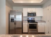 Thumbnail 6 of 57 - This is a photo of the kitchen of the 1500 square foot 3 bedroom, 2 and a half bath with 2-car garage Bellbrook floor plan at Washington Park Apartments in Centerville, OH.