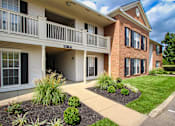 Thumbnail 58 of 61 - A building with a balcony and a brick facade.