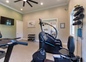 Thumbnail 53 of 61 - The 24-hour fitness center with treadmill, cycling machine, stair stepper, yoga mats and free weights at Washington Park Apartments, in Centerville, OH.