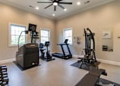 Thumbnail 51 of 61 - The 24-hour fitness center with treadmill, cycling machine, stair stepper, yoga mats and free weights at Washington Park Apartments, in Centerville, OH.