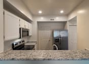 Thumbnail 6 of 61 - A kitchen with white cabinets and stainless steel appliances in the 1280 square foot, 2 bedroom, 2 and a half bath Oakwood floor plan  at Washington Park Apartments, in Centerville, OH.