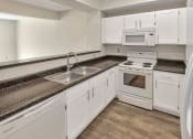 Thumbnail 7 of 57 - This is a photo of the kitchen of the 1280 square foot 2 bedroom, 2 and 1/2 bath Oakwood floor plan at Washington Park Apartments in Centerville, OH.