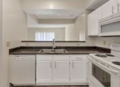 Thumbnail 8 of 57 - This is a photo of the kitchen of the 1280 square foot 2 bedroom, 2 and 1/2 bath Oakwood floor plan at Washington Park Apartments in Centerville, OH.