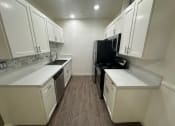 Thumbnail 36 of 55 - Kitchen at Willow Tree Apartments, California, 90505